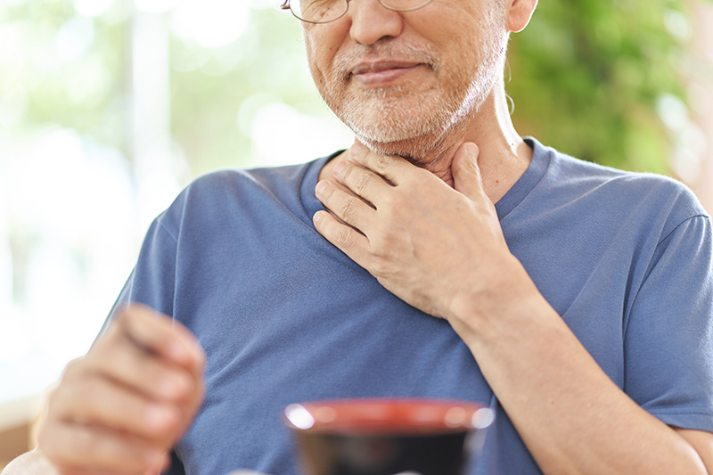 Person having difficulty swallowing
